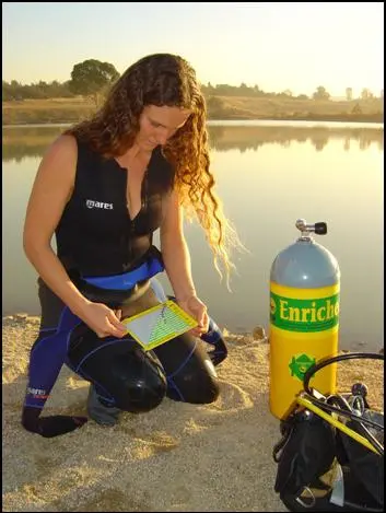 Diver logging her certification before a Nitrox dive