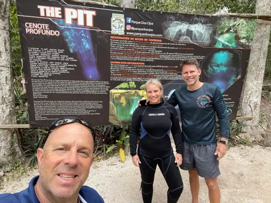 Divers at The Pit cenote in Riviera Maya before a cenote diving trip