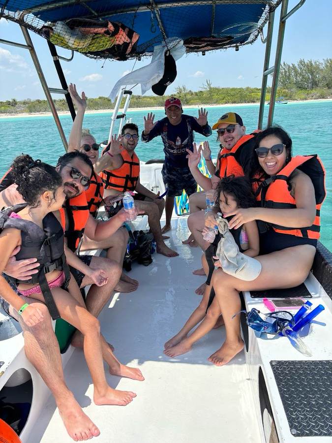 Family group aboard the boat before a snorkeling tour in Playa del Carmen